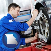 mo map icon and a mechanic adjusting a wheel alignment machine clamp