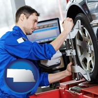 ne map icon and a mechanic adjusting a wheel alignment machine clamp