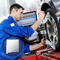 new-mexico map icon and a mechanic adjusting a wheel alignment machine clamp