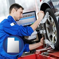 utah map icon and a mechanic adjusting a wheel alignment machine clamp