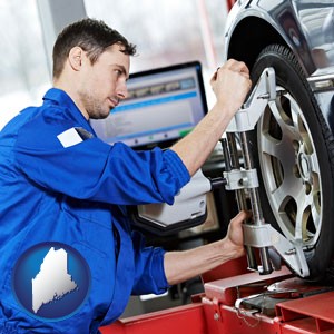 a mechanic adjusting a wheel alignment machine clamp - with Maine icon